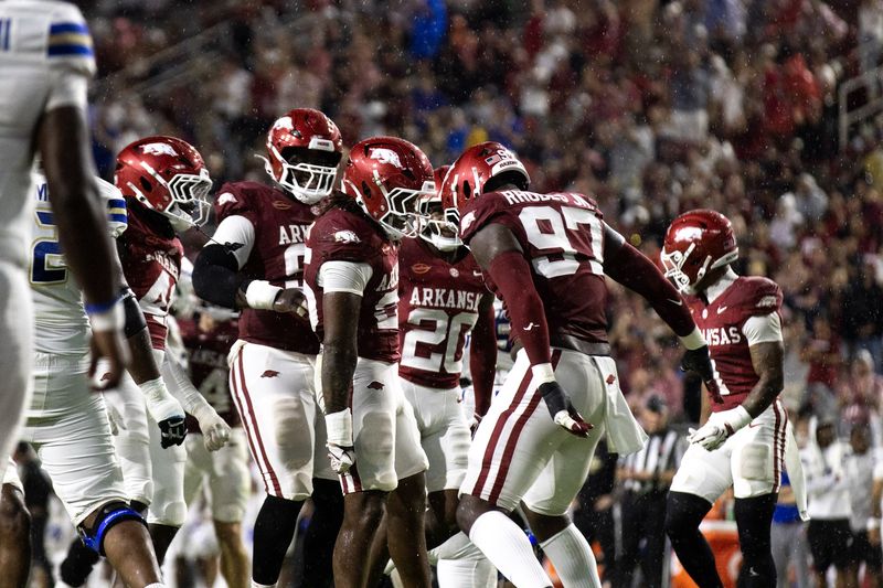 Razorback defenders celebrate a stop at night