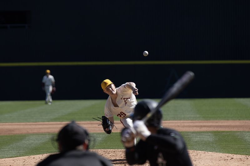 Razorback pitcher delivers a pitch as the batter waits